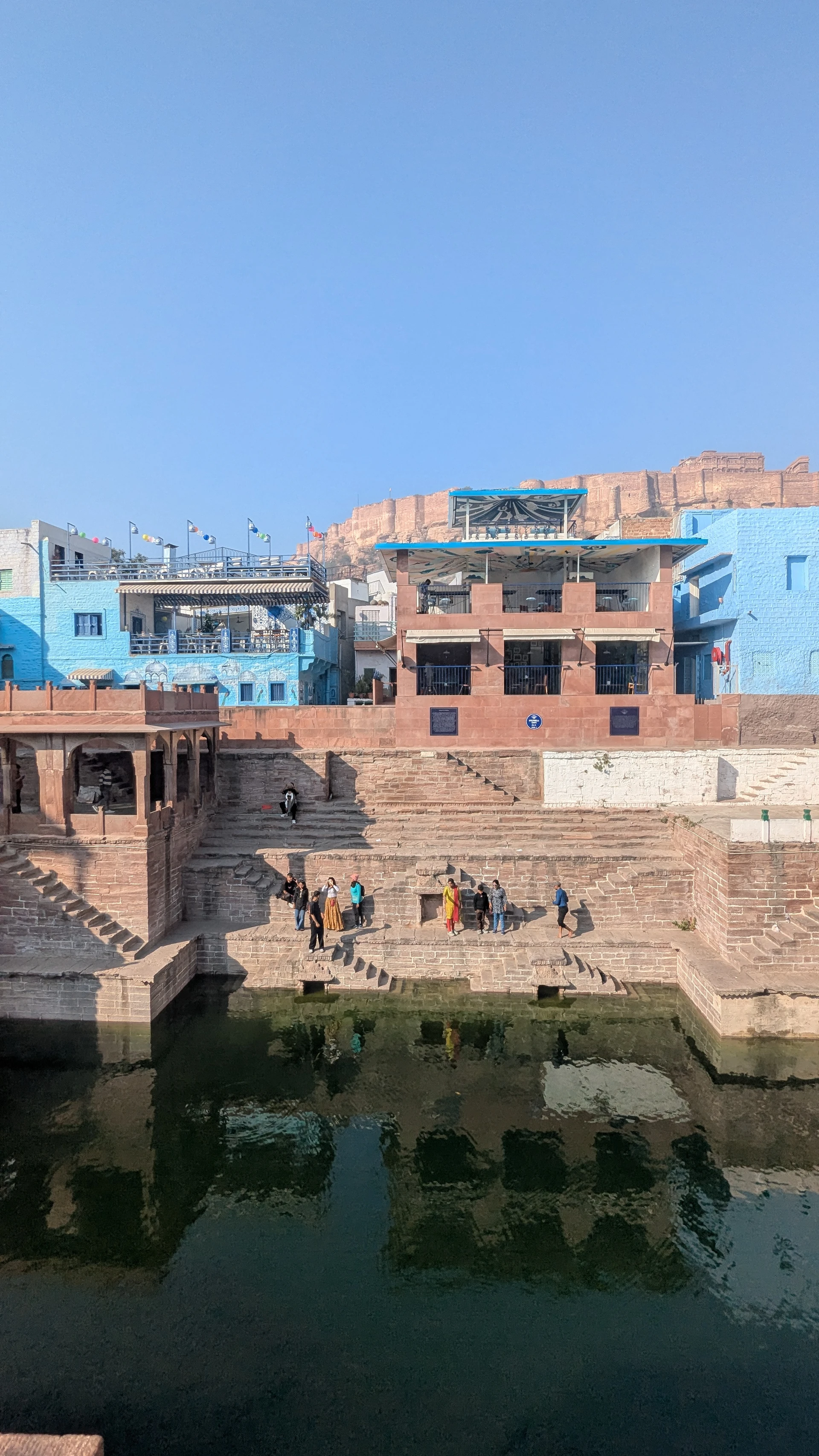 Toorji Ka Jhalra stepwell in Jodhpur, symmetrical stone steps descending into water