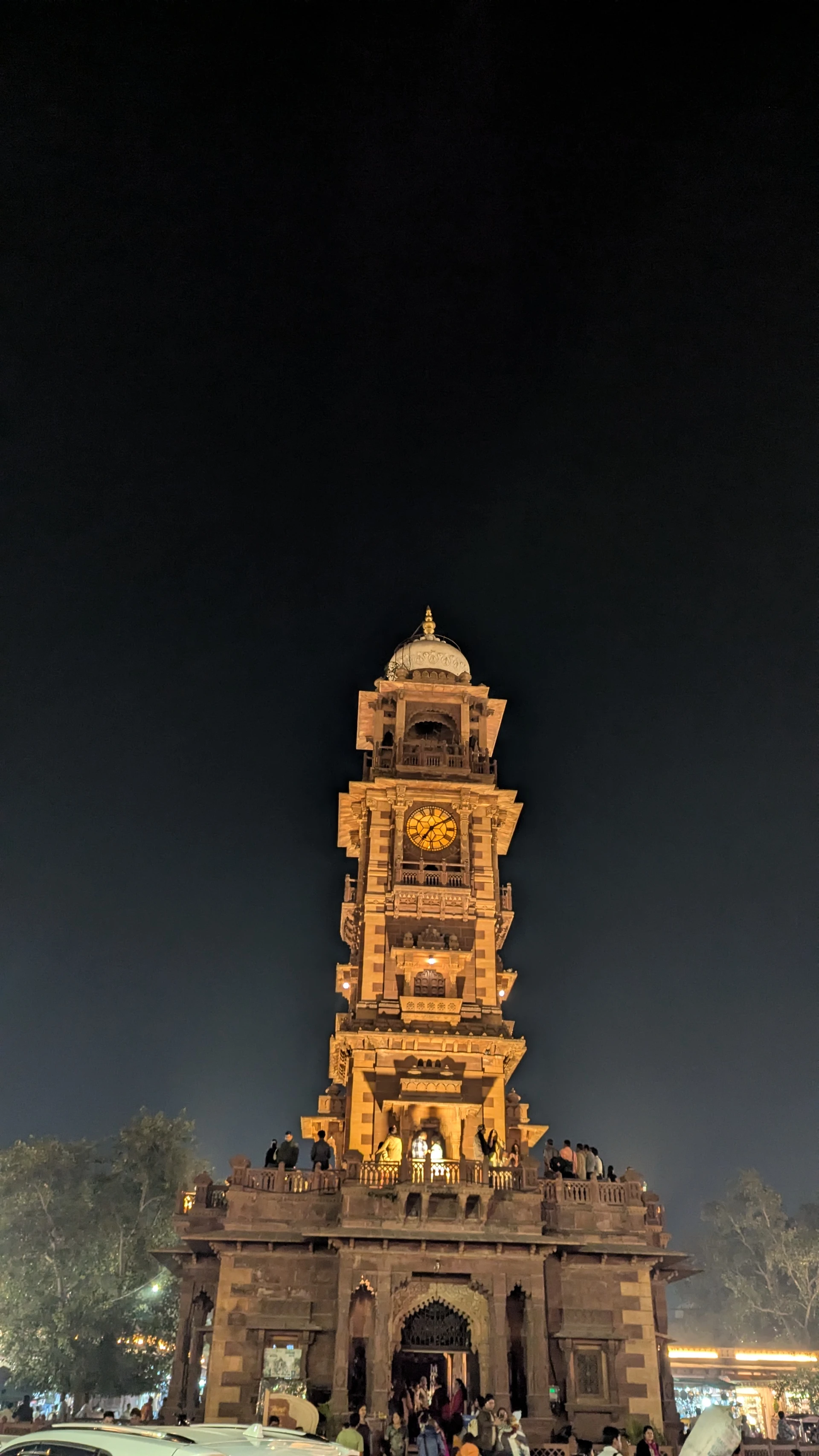 Ghanta Ghar Clock Tower in Jodhpur lit up at night above the Sardar Market