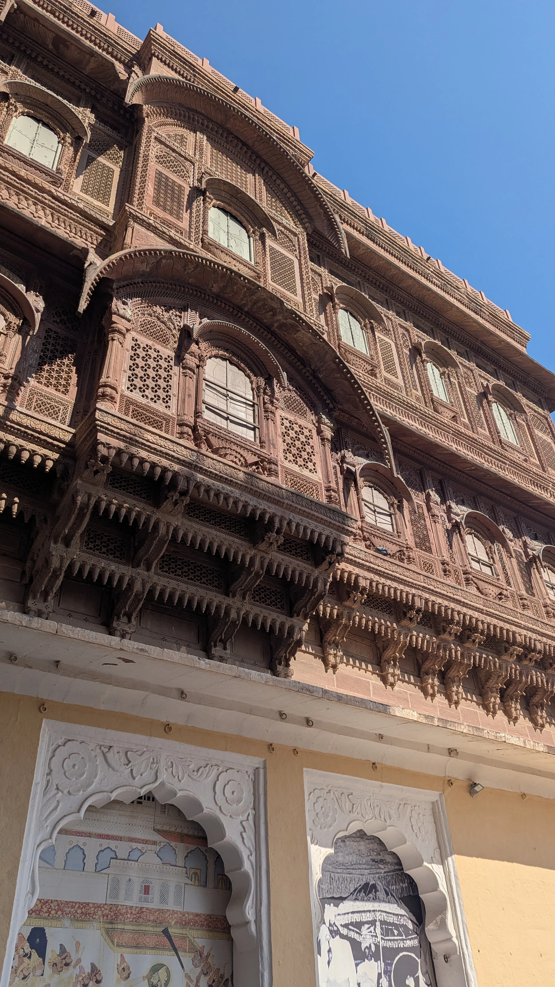 Intricately carved sandstone jharokha balconies at Mehrangarh Fort, Jodhpur