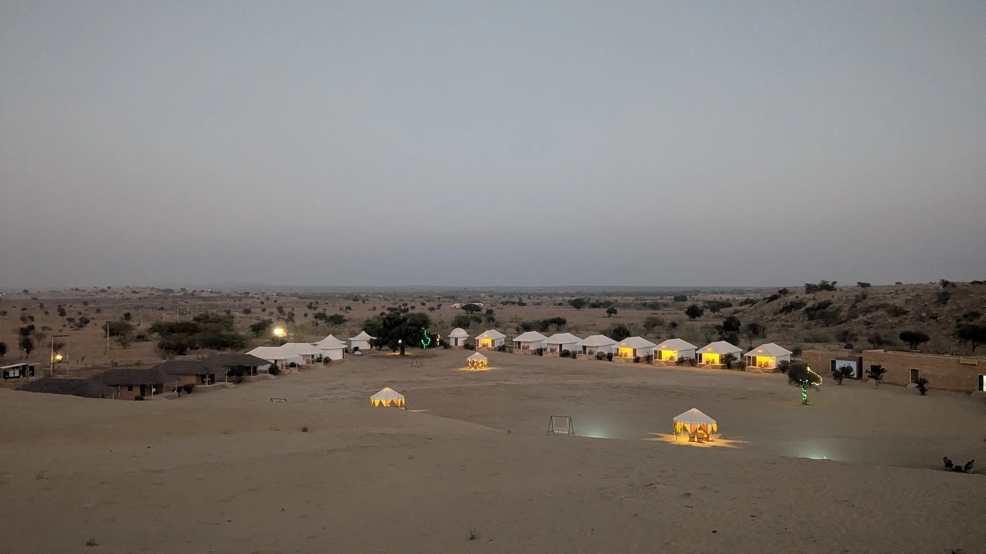 The dunes at Tejsi near Baran after dark, faint ambient glow across the sand