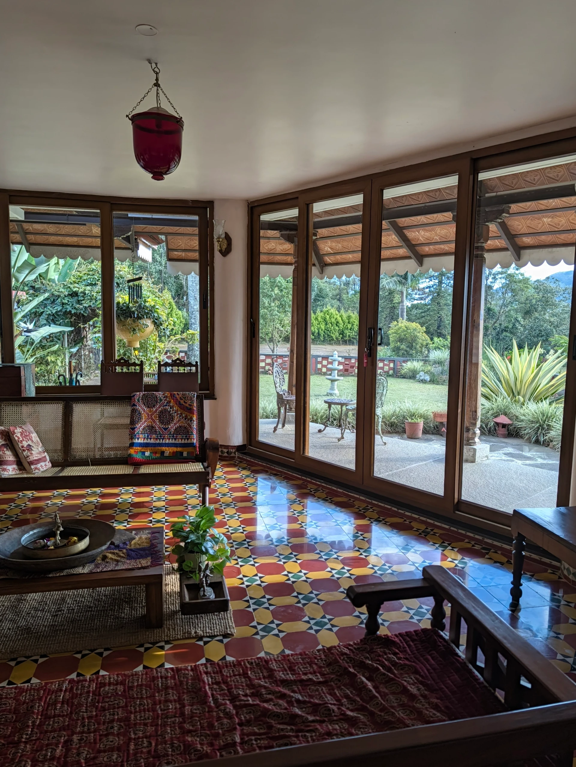 Sunlit room at Woodway Estate with mosaic tiled floor and a view of the estate
